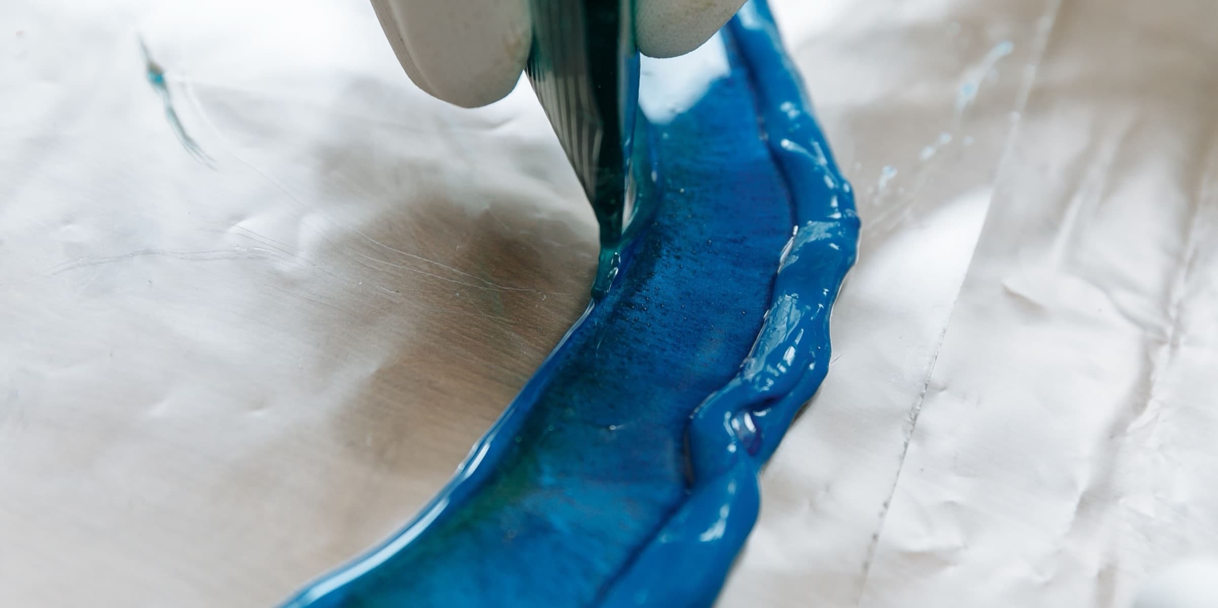 Blue resin poured onto a sheet